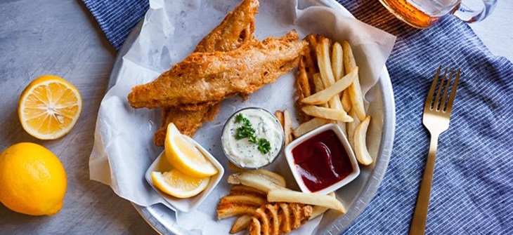 Banana blossom fish and chips sits on wax paper