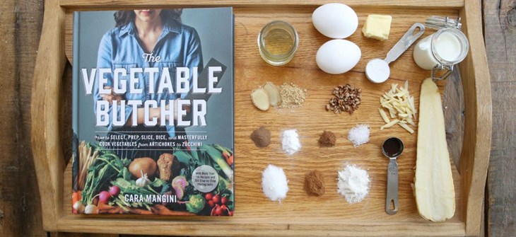 (Credit: The Star) Copy of book sits on brown serving platter next to assorted spices