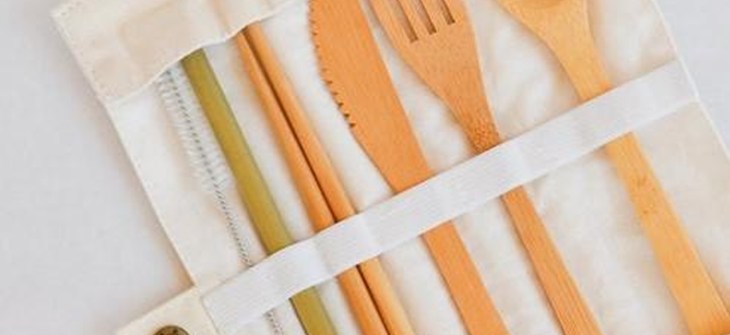 (Credit: Silk+Sirena) Bamboo Utensil Set sits in beige canvas travel pouch