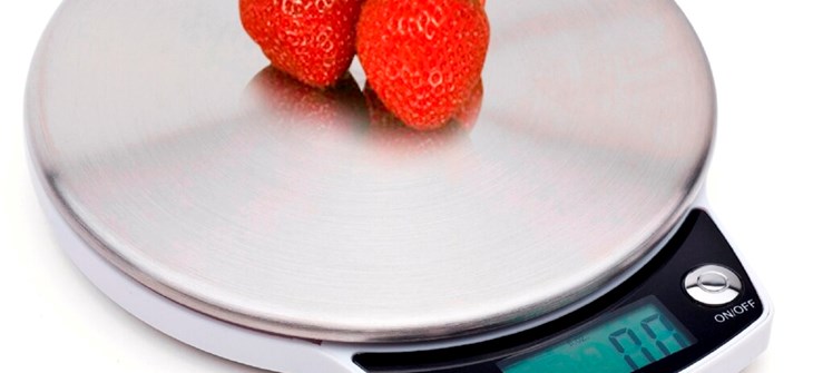 (Credit: Wayfair) two strawberries sit on a silver kitchen scale on a white background