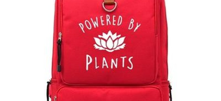 (Credit: Leafy Souls) Red backpack with white script that reads "powered by plants"