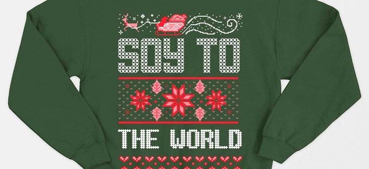 (Credit: Vegan Outfitters) Green sweater on white background with design in red that reads "Soy to the world"