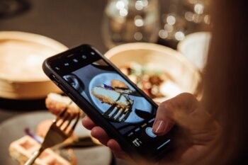 A diner taking photos of the historic meal