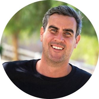 Ben smiling at the camera wearing a black Compassion in World Farming t-shirt