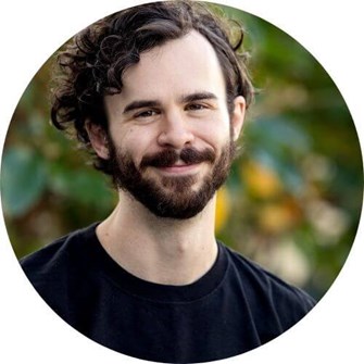 Jeff smiling at the camera, wearing a black t-shirt