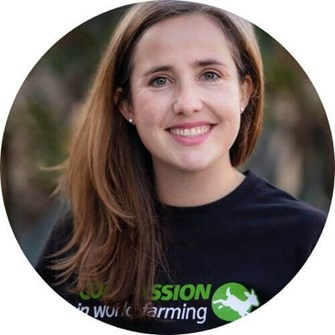 Hillary smiling at the camera, wearing a black Compassion in World Farming t-shirt