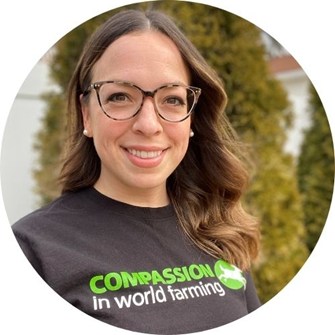 Meghan smiling at the camera, wearing a Compassion in World Farming t-shirt