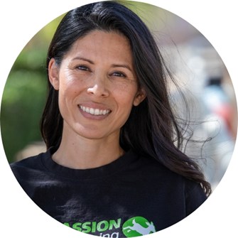 Marissa Valladolid smiling at the camera and wearing a black Compassion in World Farming t-shirt