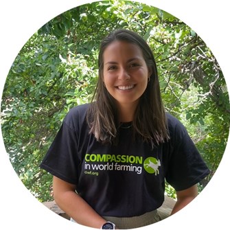 Jenna smiling at the camera wearing a CIWF shirt