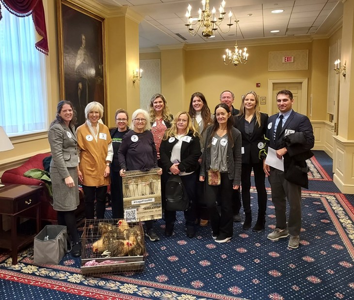 A group of supporters of SB0193 pose for a photo in the Senate building.
