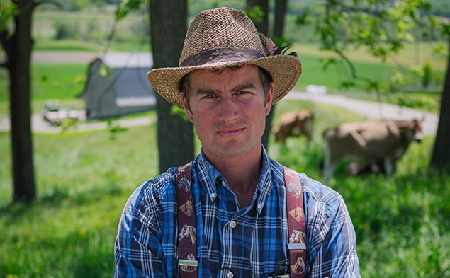 Vernon Martin a farmer standing outside in natural surroundings in summer